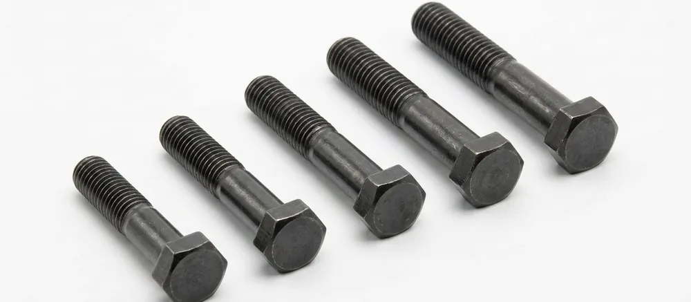 Self-colour imperial hex bolts with plain shanks, threads pointing to the top left