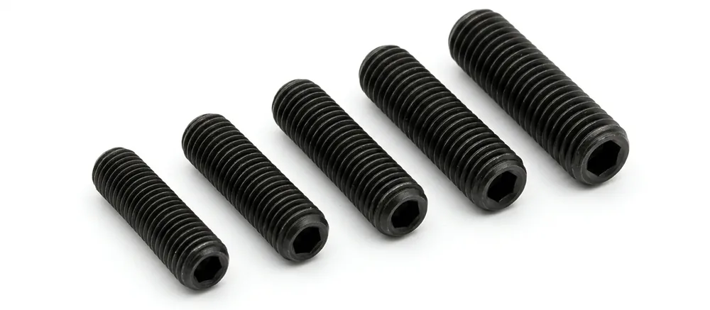 Self-colour cup point grub screws in a row, axes pointing to the top left