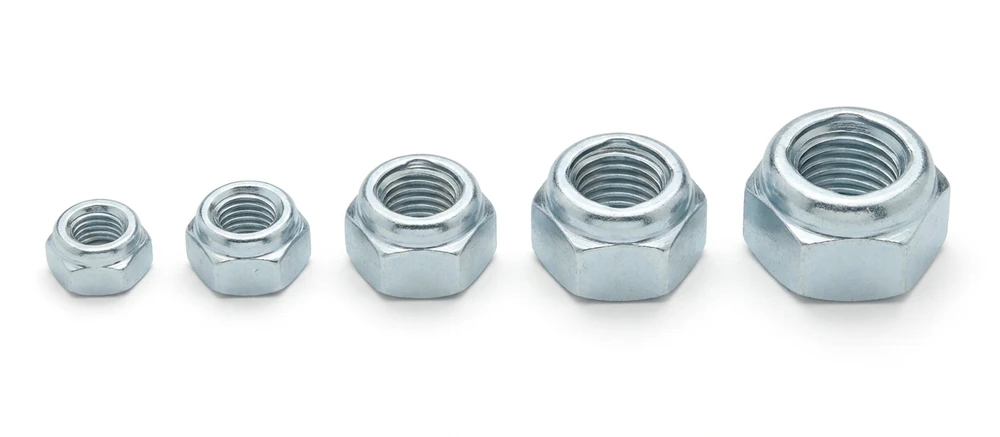 Five zinc plated Stover all-metal lock nuts in a row on white, each with a crimped rounded crown